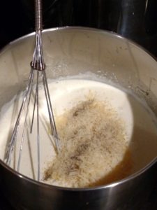 stirring alfredo sauce in saucepan