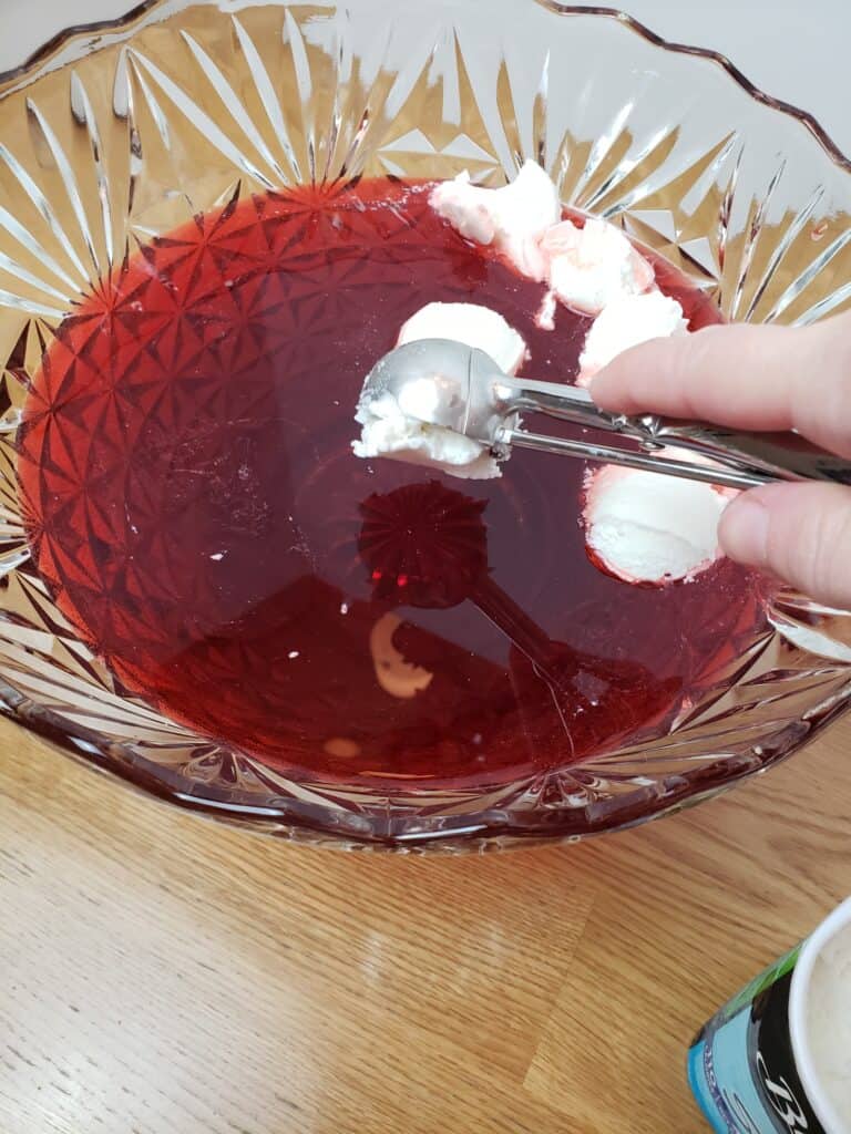 scooping ice cream into punch