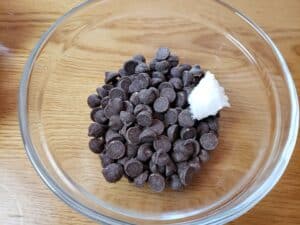 chocolate chips and coconut oil in glass bowl