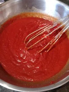 whisking ketchup ingredients together