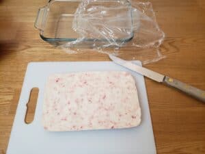 Easy Keto Peppermint Fudge on cutting board ready to cut