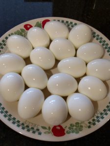 plate full of perfectly peeled hard boiled eggs