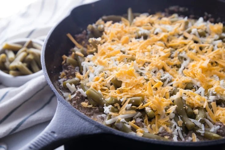 Keto Ground Beef Recipe in a cast iron skillet before putting it in the oven