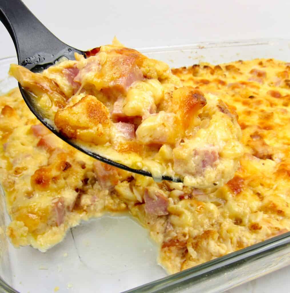 cauliflower and ham casserole with serving spoon full